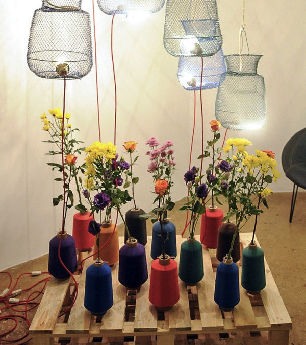 colorful vases w/floral + bottom up wire container lights = love