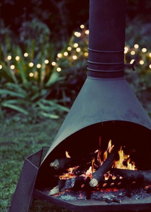 outdoor fireplace + white garden lights = fall garden party