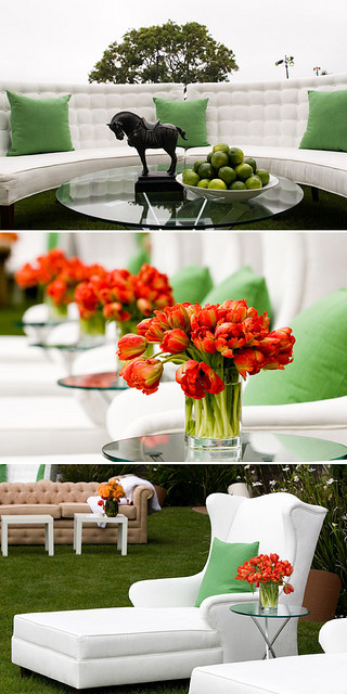 chic polo PARTY | red tulips + green apples + white tufted sofas + wingback chaise + green throw pillows